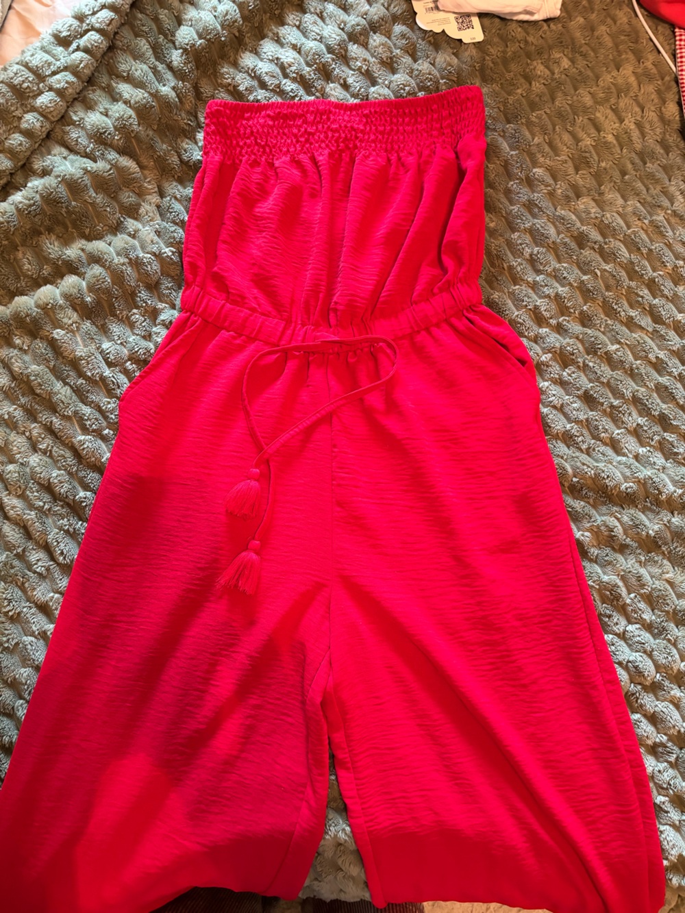 Bright Red Strapless Jumpsuit with Tassel Tie and cinched waistband